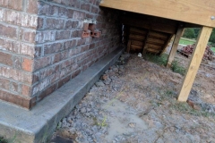 brick skirt under stairs
